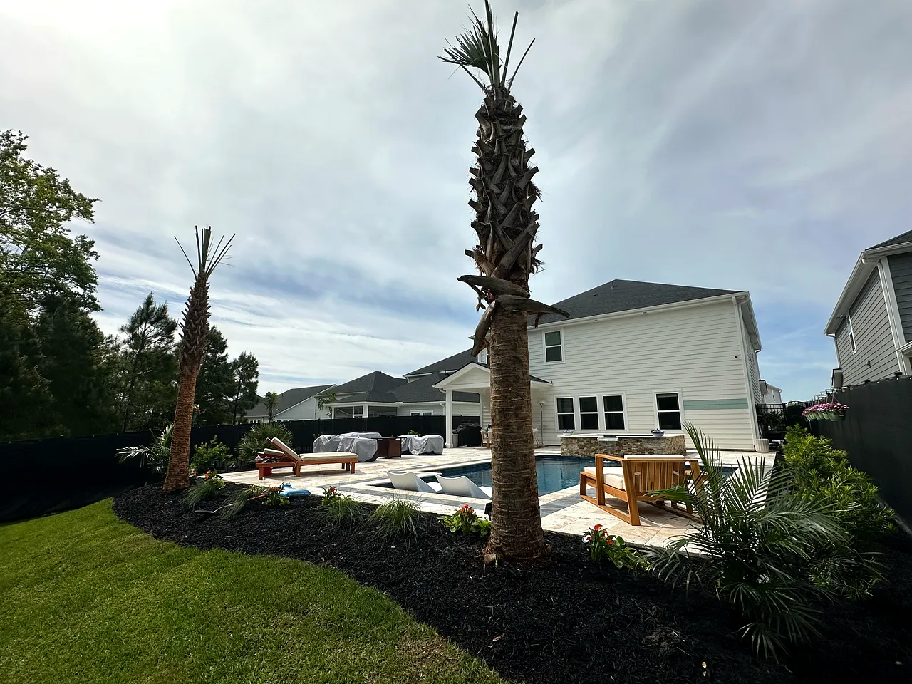 A well-kept home exterior and lawn at golden hour in Myrtle Beach.